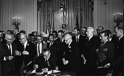 President Lyndon B. Johnson signs the 1964 Civil Rights Act