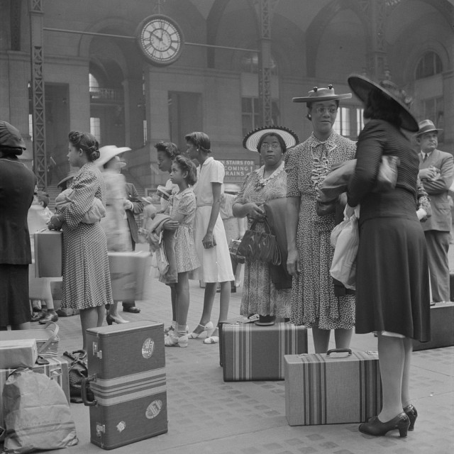 New York, New York. Waiting for the trains at the Pennsylvania railroad station.